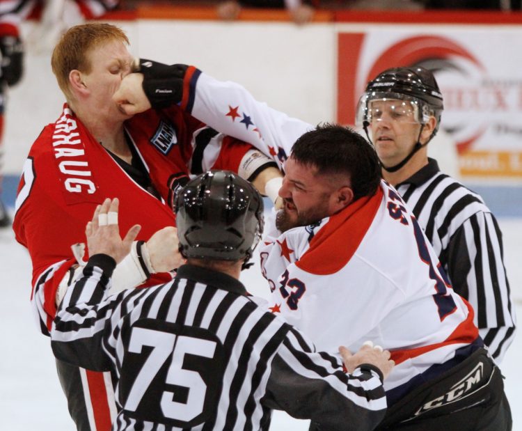 PHOTO by ALLISON PAPINEAU: River Kings enforcer Michael Stacey lands a punch on Mike Varhaug of the Braves in LNAH action on Friday night in Laval.