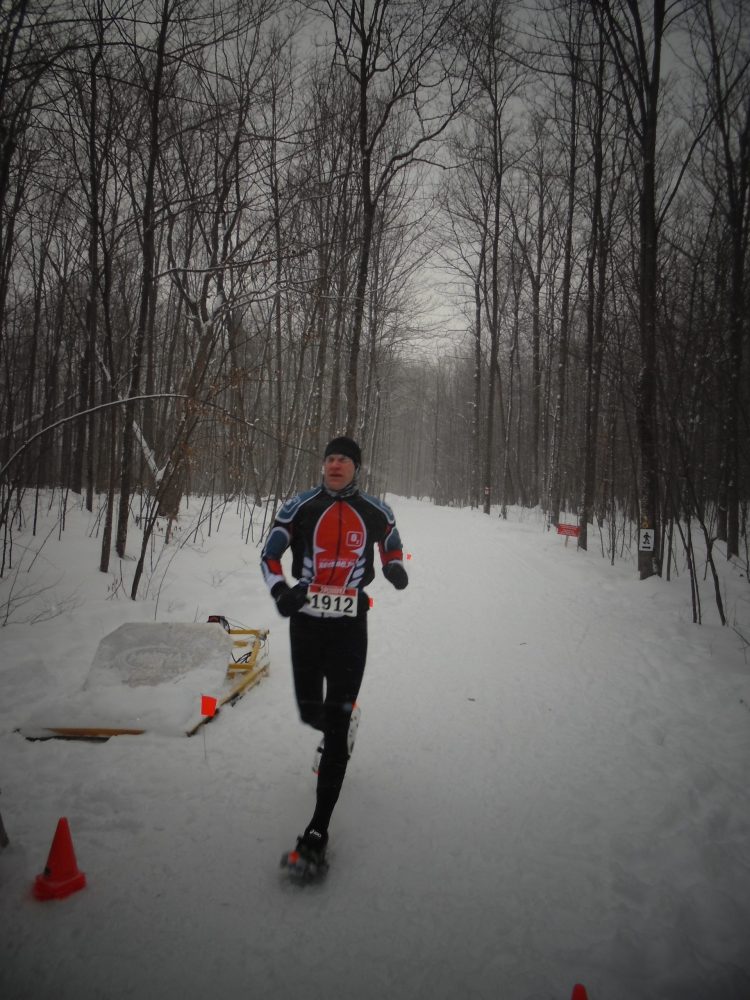 Area resident Rob Lefebvre crossing the finish line in 4th place at the Summerstown Forest Dion Snowshoe Race which was held this past Saturday. Rob is very familiar with the course, living just down the road from Summerstown Forest. Photo credit : FOTST