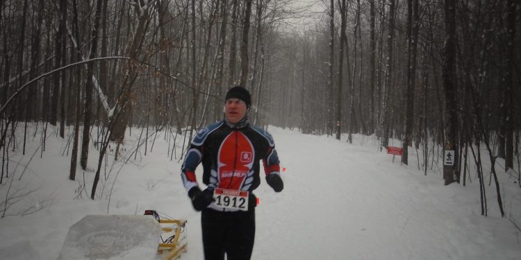 Area resident Rob Lefebvre crossing the finish line in 4th place at the Summerstown Forest Dion Snowshoe Race which was held this past Saturday. Rob is very familiar with the course, living just down the road from Summerstown Forest. Photo credit : FOTST