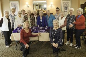 Knitting Purple Tuques for a Good Cause