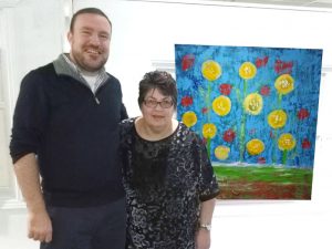 cropped Lynne and Eric with painting