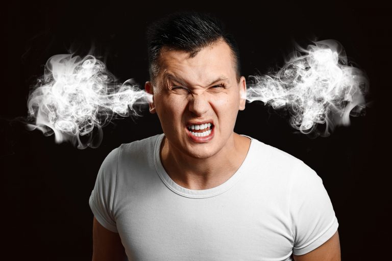 Portrait of an evil man whose steam comes out of his ears. The concept of frustration, anger, nenovisty.