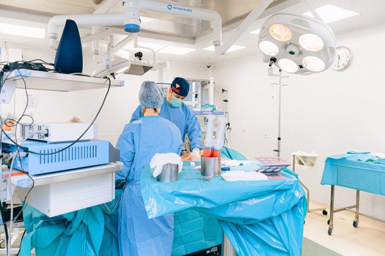 doctor-and-nurse-doing-a-liposuction-3844550
