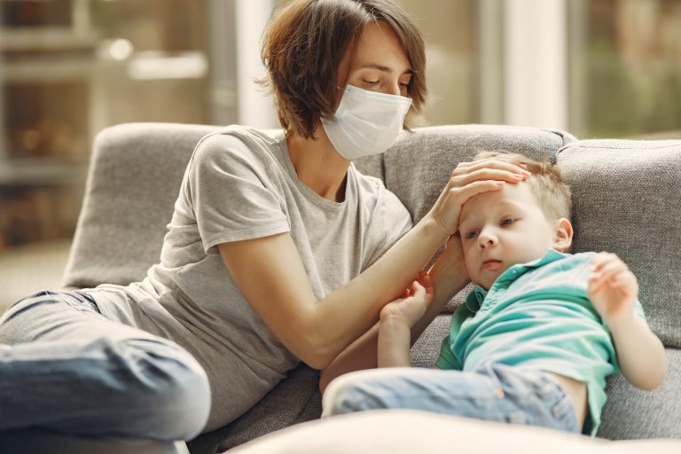 mother-checking-his-son-if-he-has-fever-3985214