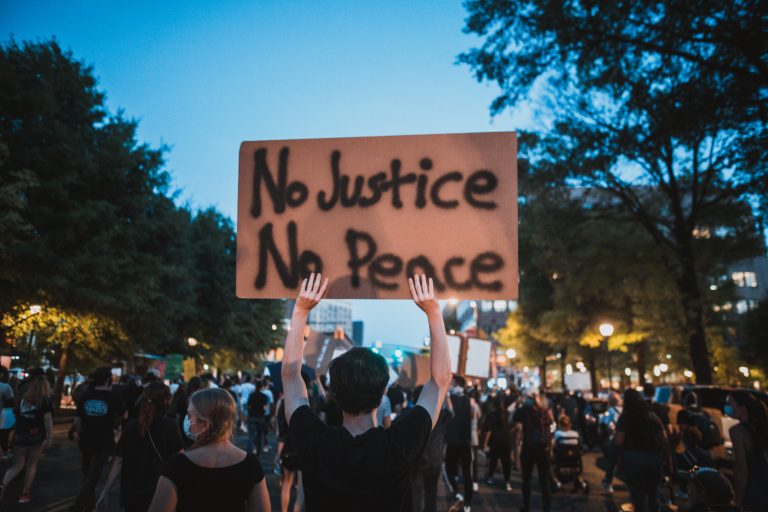 protester-holding-a-sign-4552859