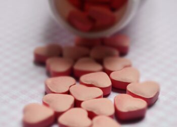 selective focus photo of pink tablets