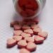 selective focus photo of pink tablets