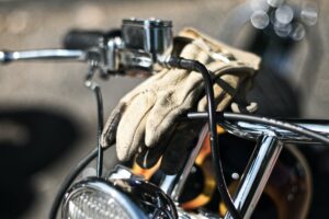 photo of a glove on motorcycle handlebar