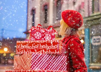 woman carrying christmas presents