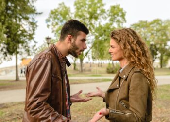 man and woman wearing brown leather jackets