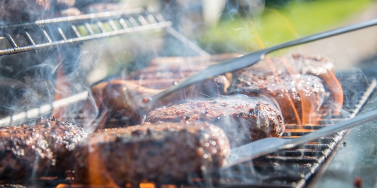 close photography of grilled meat on griddle
