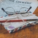 letters and an eyeglass on table