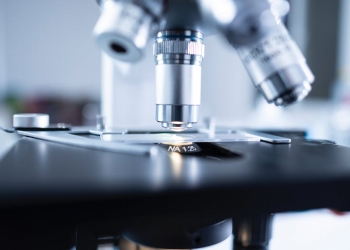 shallow focus photography of microscope