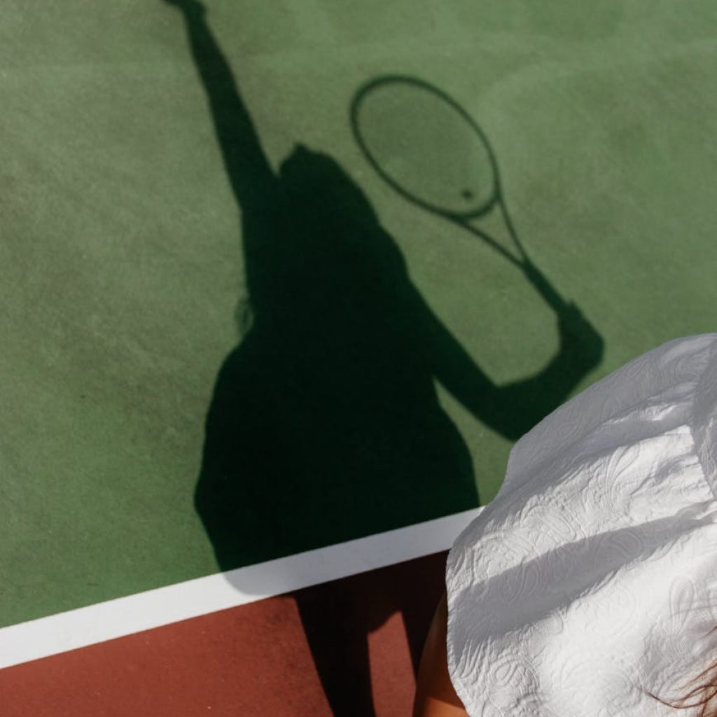 shadow of woman playing tennis