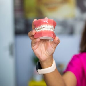 person holding red heart shaped ornament