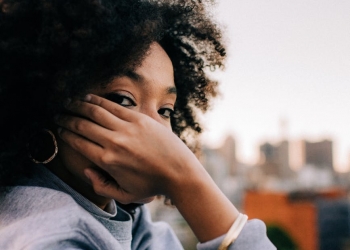 woman in gray sweater