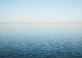 calm sea under blue sky