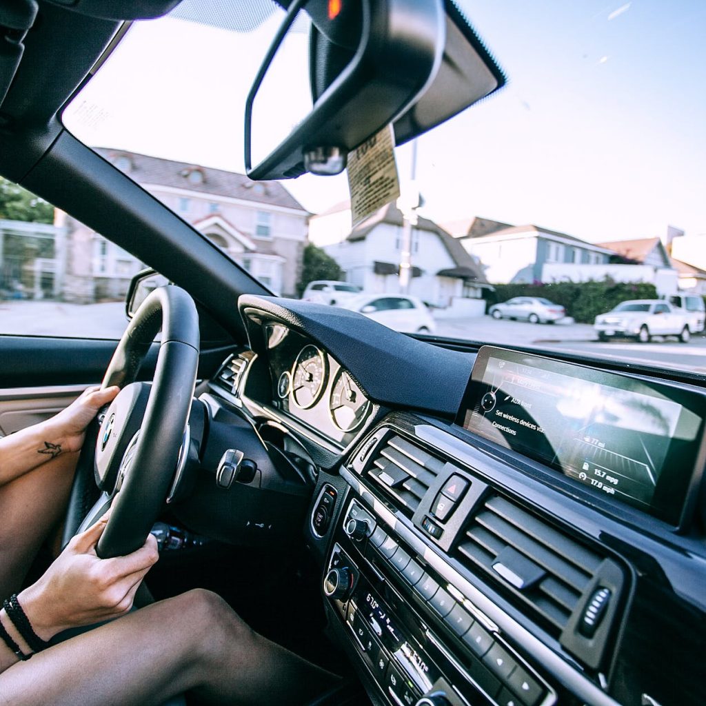 anonymous woman driving car in town