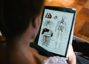 photo of woman studying anatomy