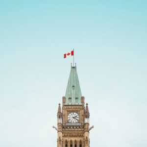 brown and white concrete building under blue sky