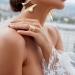 crop fashionable bride in wedding dress and gold accessories
