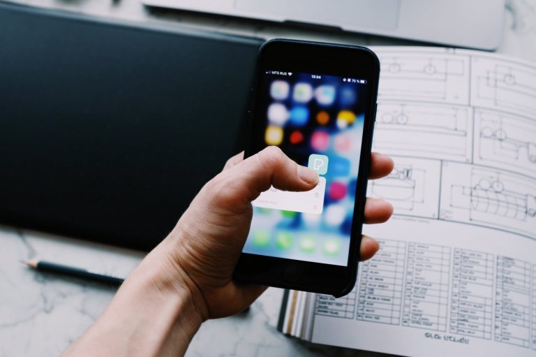 person holding black smartphone