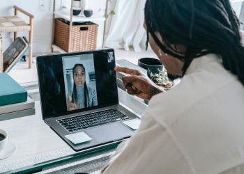 stressed black couple having video call via laptop