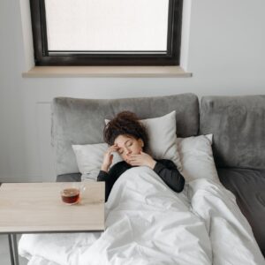 sick woman lying on the sofa