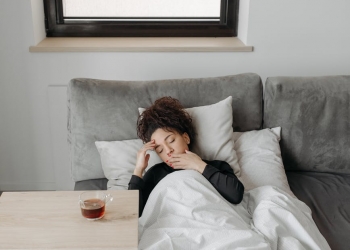 sick woman lying on the sofa