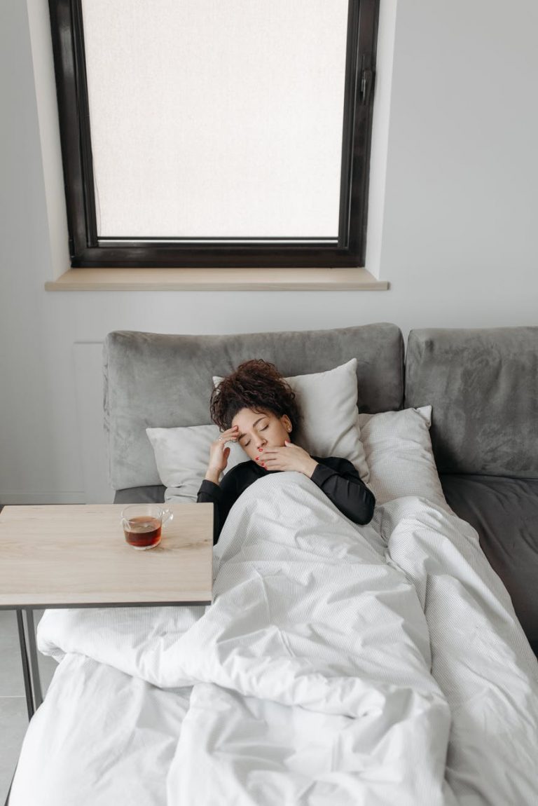 sick woman lying on the sofa