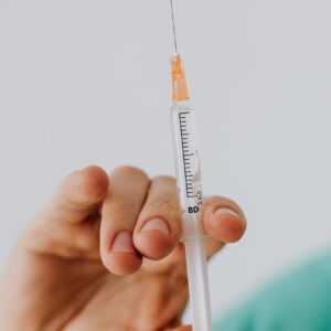 close up view of person holding a vaccine
