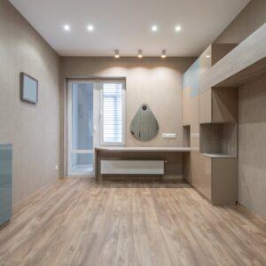 spacious room with cupboards and door