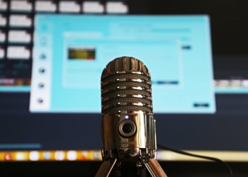 selective focus photography of gray stainless steel condenser microphone