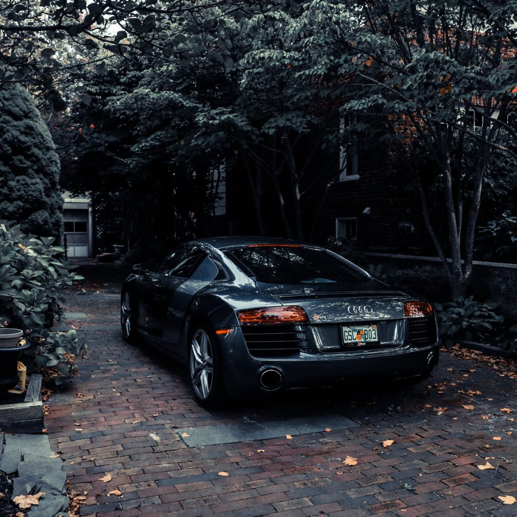photo of audi parked near trees