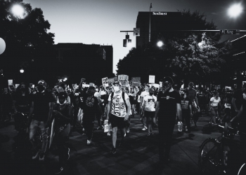 grayscale photo of people walking on street