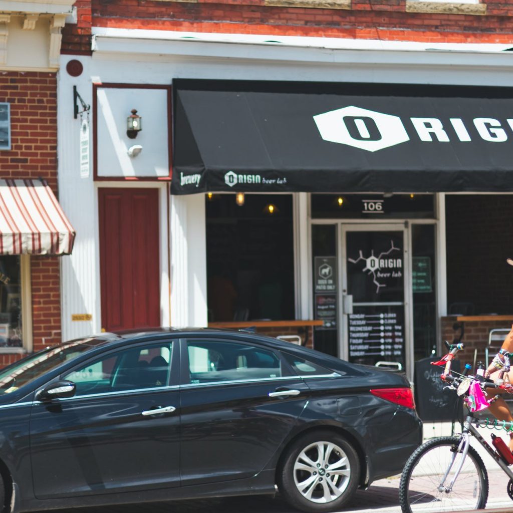 black hyundai sonata sedan parked beside building