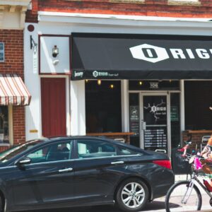 black hyundai sonata sedan parked beside building