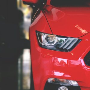 red car parked on pavement