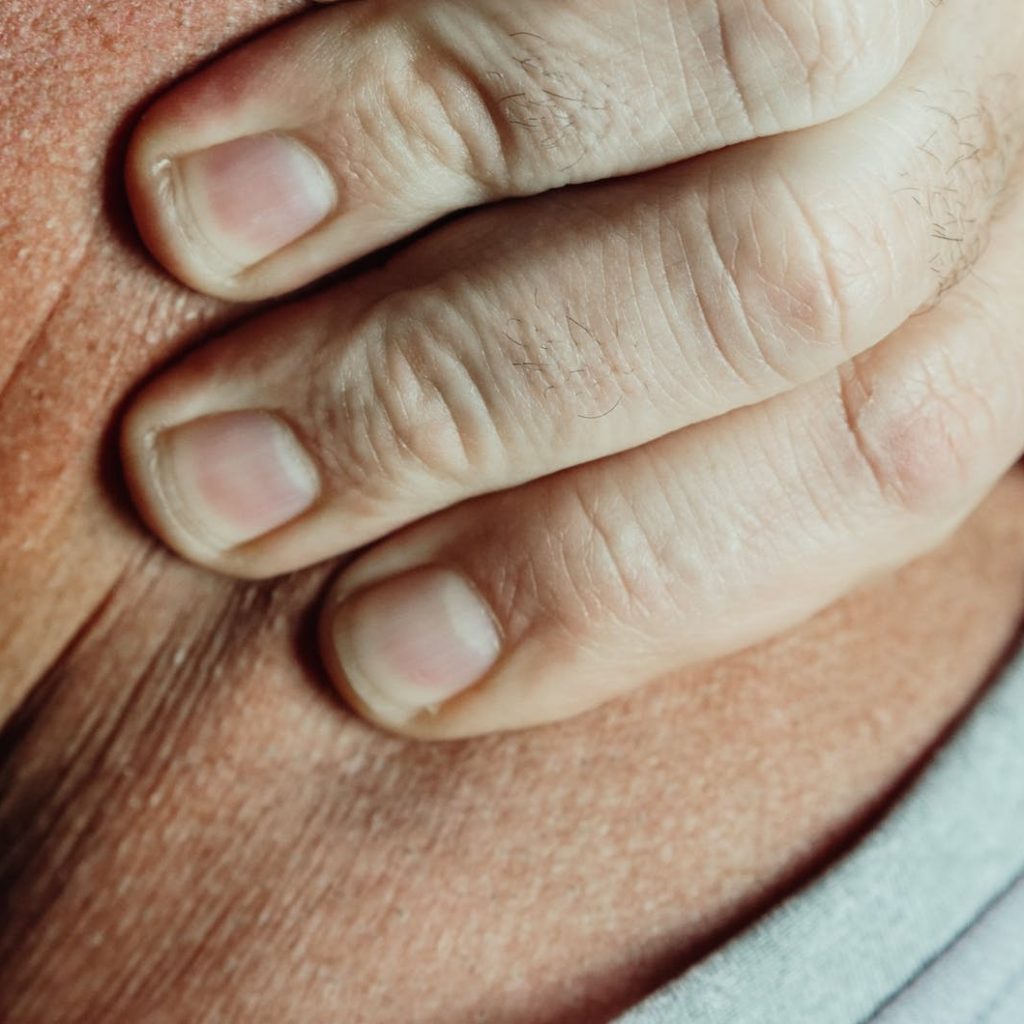 close up photo of a person having a neck pain