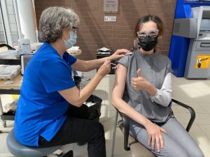 Dr. Renee Givari (right), Chief of Medicine and Intensivist at CCH, receives her second dose of the COVID-19 vaccine, May 2021