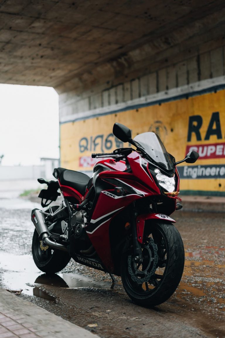 red and black sports bike
