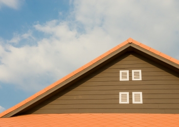 orange and gray painted roof under cloudy
