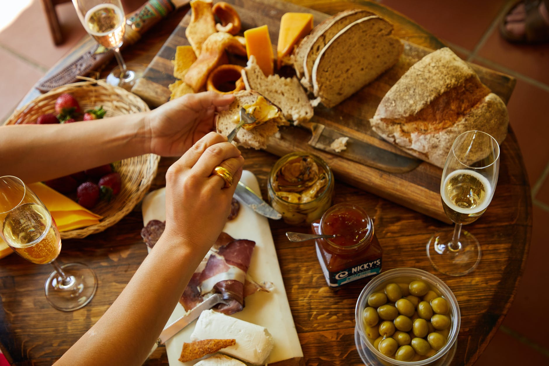 person holding bread with cheese