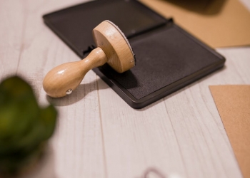wooden stamp on ink pad placed on desk