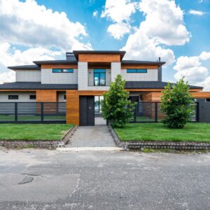 exterior of fenced modern villa in suburb area