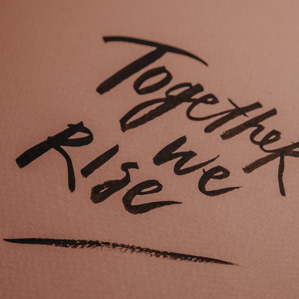 handwritten love people sand