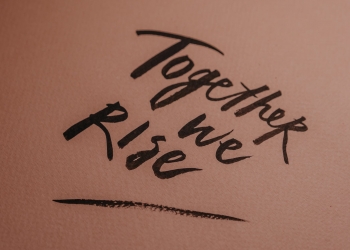 handwritten love people sand