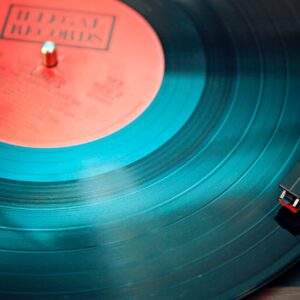 blue vinyl record playing on turntable