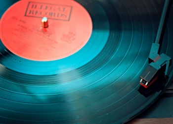 blue vinyl record playing on turntable