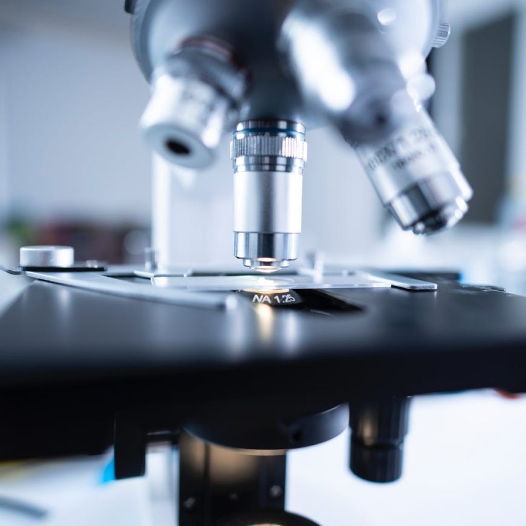 shallow focus photography of microscope